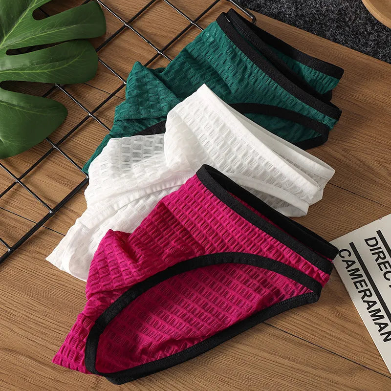 Men's low waist transparent lace underwear in multiple colours on a white background.