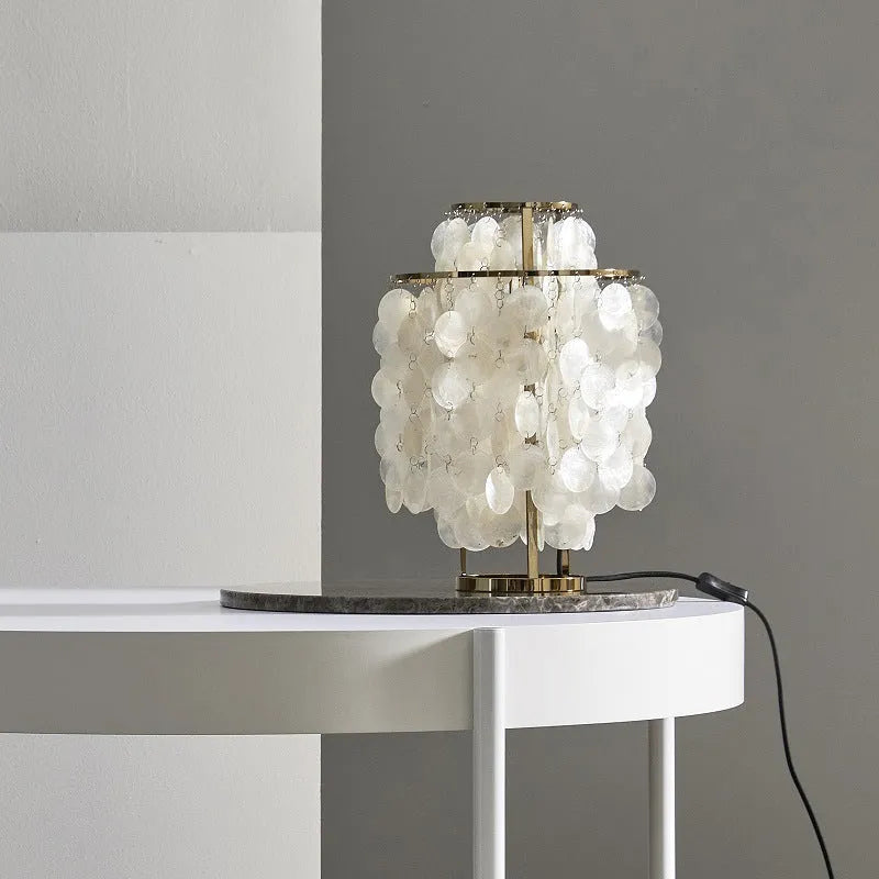 Shell-shaped bedside table lamp with modern design in chrome or gold finish