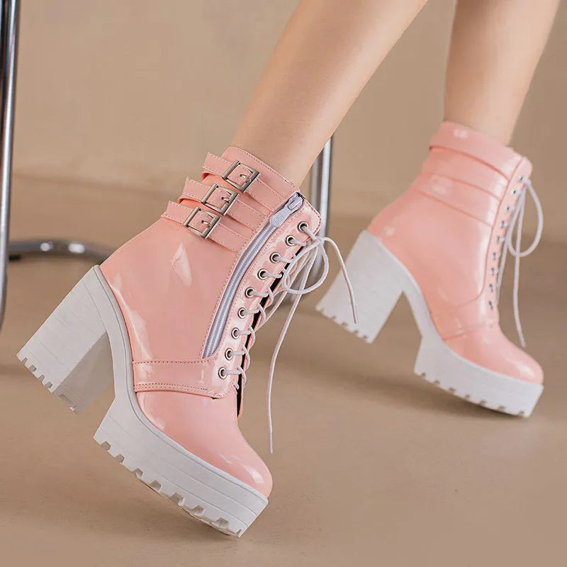 Women's black thick-heel short boots with front lace-up and round toe on a waterproof rubber sole.