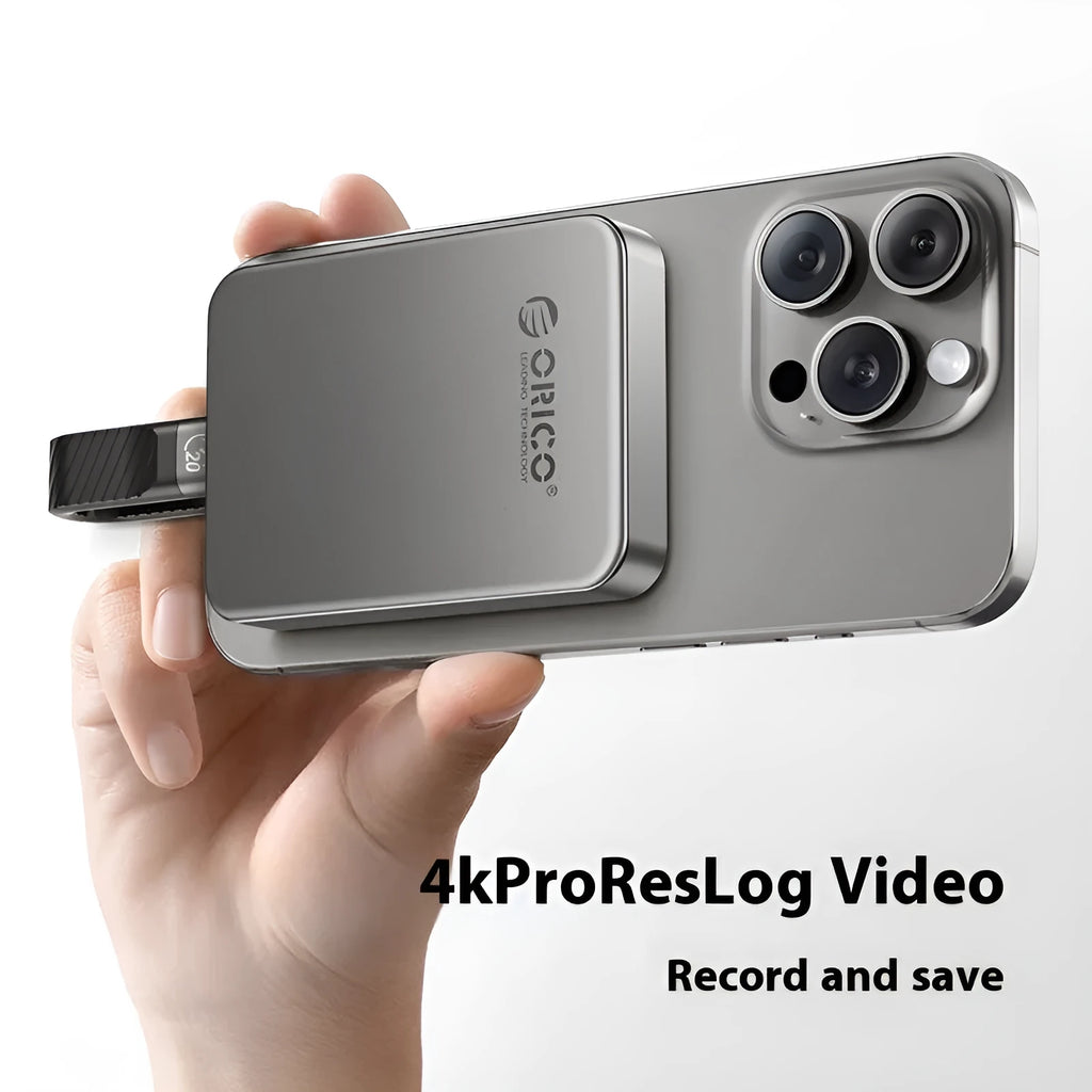 Grey magnetic mobile solid-state drive with suction ring attachment and ultra-thin design