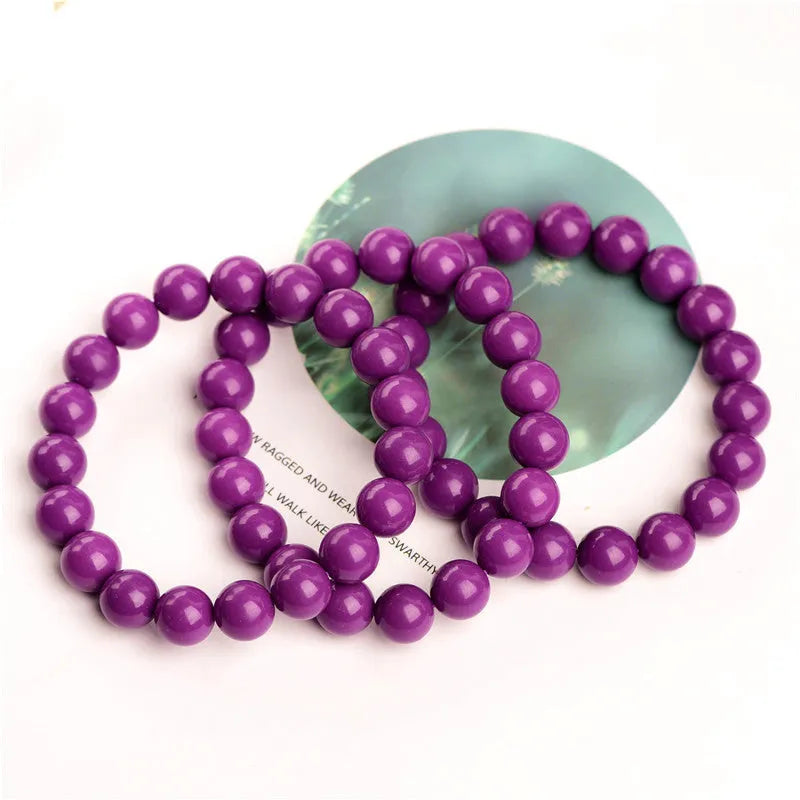 Jiuya polished purple mica crystal bracelet in a single circle design on a wrist.