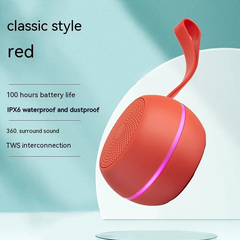 Mini Bluetooth speaker in red with waterproof and drop-resistant plastic body and voice prompt function