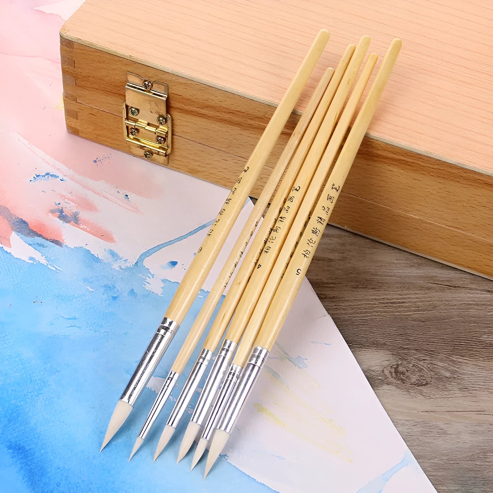 Six wooden handle wool pointed brushes for textile crafts in conventional colours