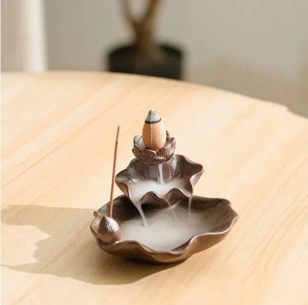 Square purple clay ceramic incense burner with lotus and plum blossom motifs