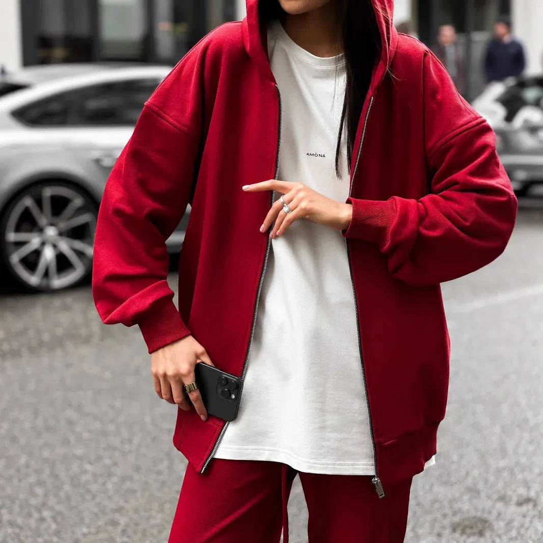 Street style loose fit two-piece set showing long-sleeved coat and matching trousers in solid colour