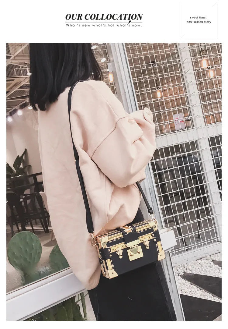 Women's hard frame shoulder bag in black or green with single adjustable strap and flap closure