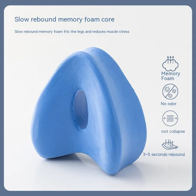 Heart-shaped dark blue jacquard memory foam leg pillow for adult knee support.