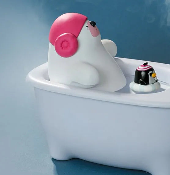 White USB air humidifier with large water tank on a desk next to a laptop.