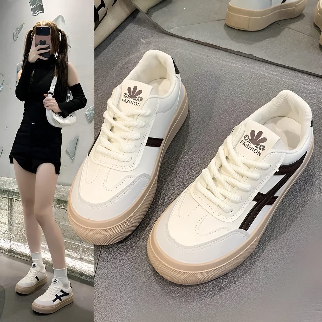 Classic brown and blue low-top casual trainers with flat rubber sole and lace-up front.