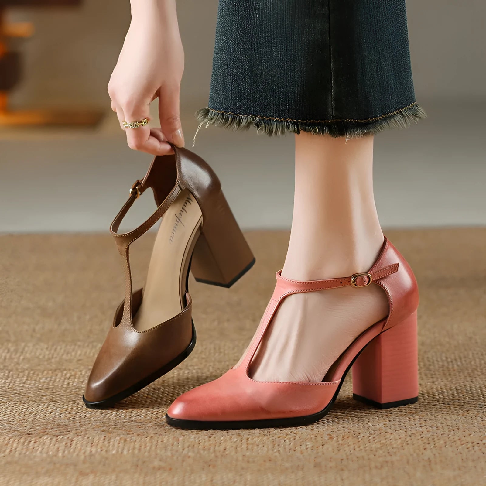 Women's retro pointed toe Mary Jane heels in dark brown with a buckle strap and hollow front design.