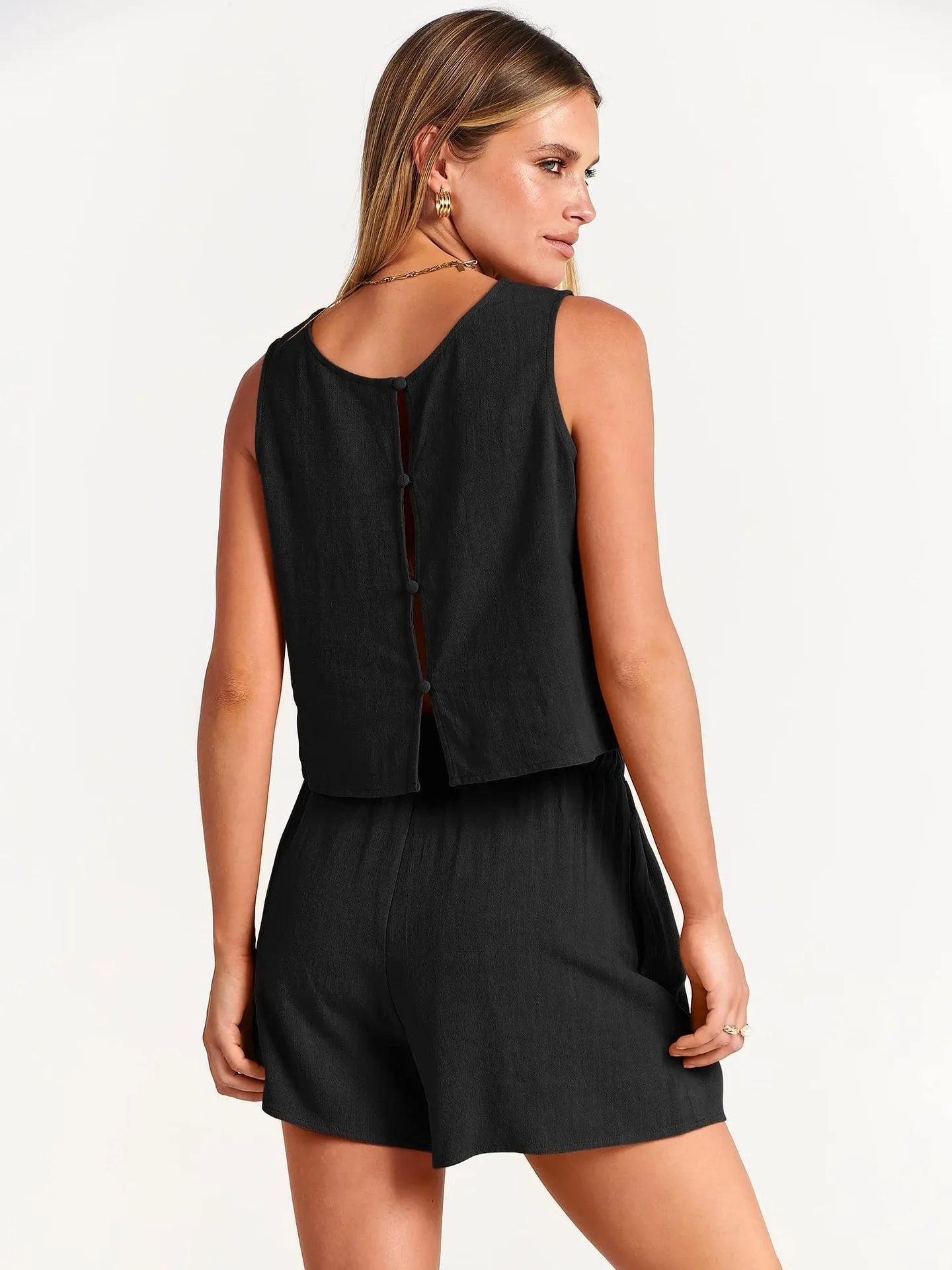 Women's apricot coloured sleeveless top and matching drawstring shorts summer set on a hanger.