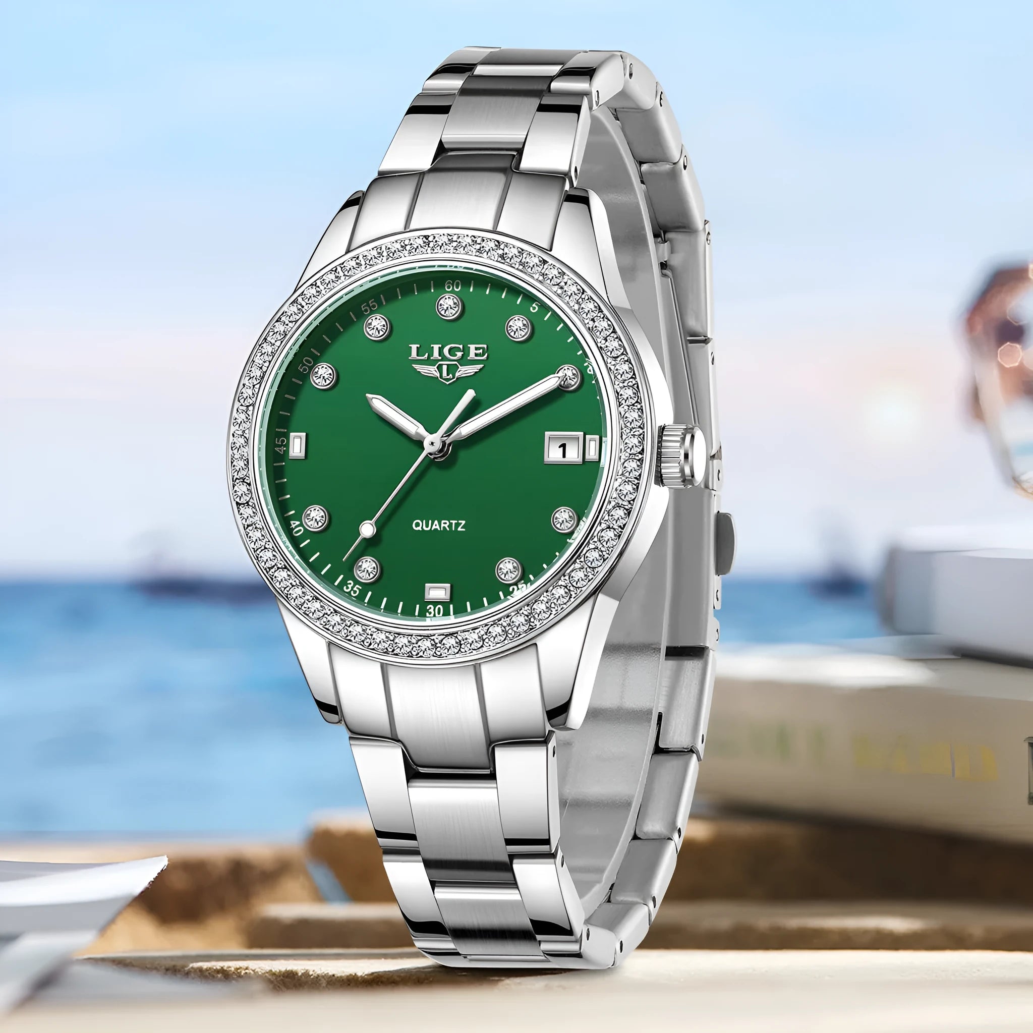 Silver fashion quartz watch with diamond-encrusted round dial and stainless steel case on wrist.