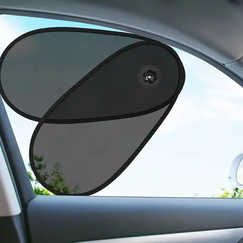 Black breathable car window shade with suction cups stretched across a car side window