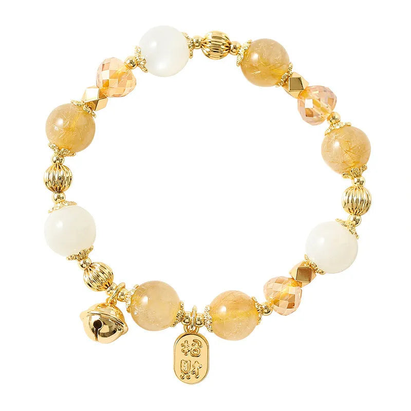 Gold rutilated quartz ringing bell bracelet with Korean style design and electroplated crystal construction