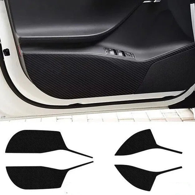 Four carbon fibre protective film pieces for Tesla Model S interior door panels.