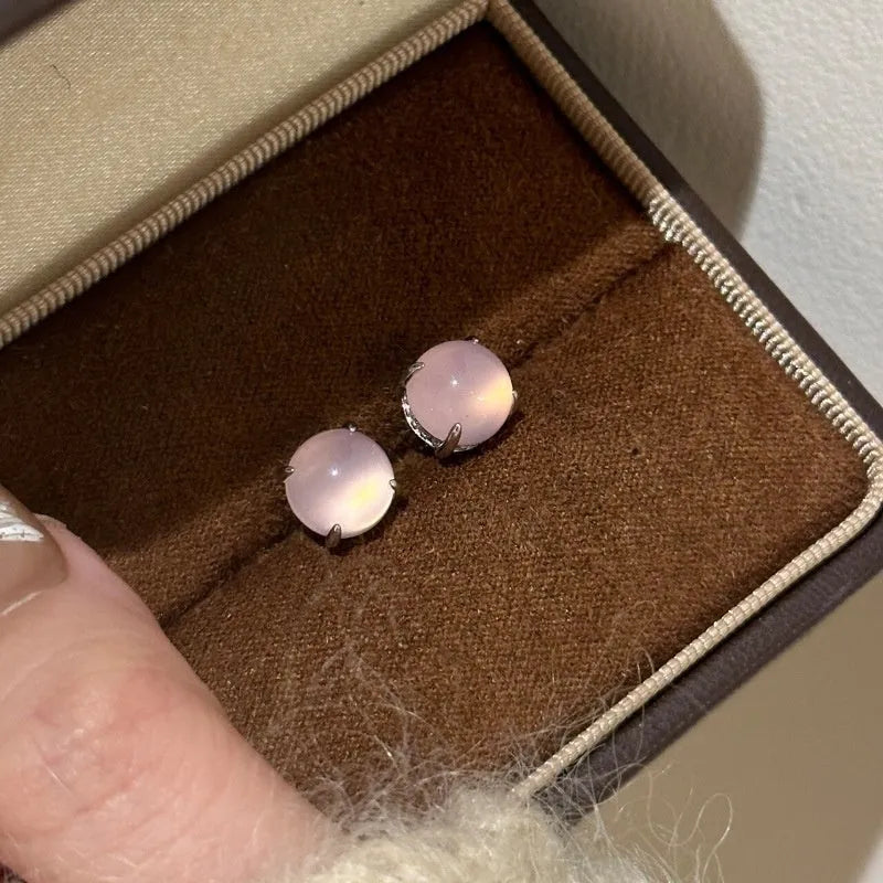 Round egg surface chalcedony stud earrings with four-claw copper setting in emerald green colour