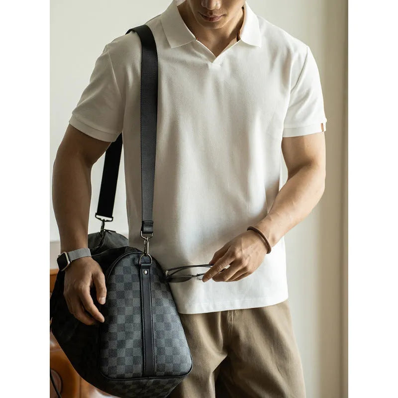 American-style light blue cotton blend short-sleeve polo shirt laid flat, showing regular fit and button placket.