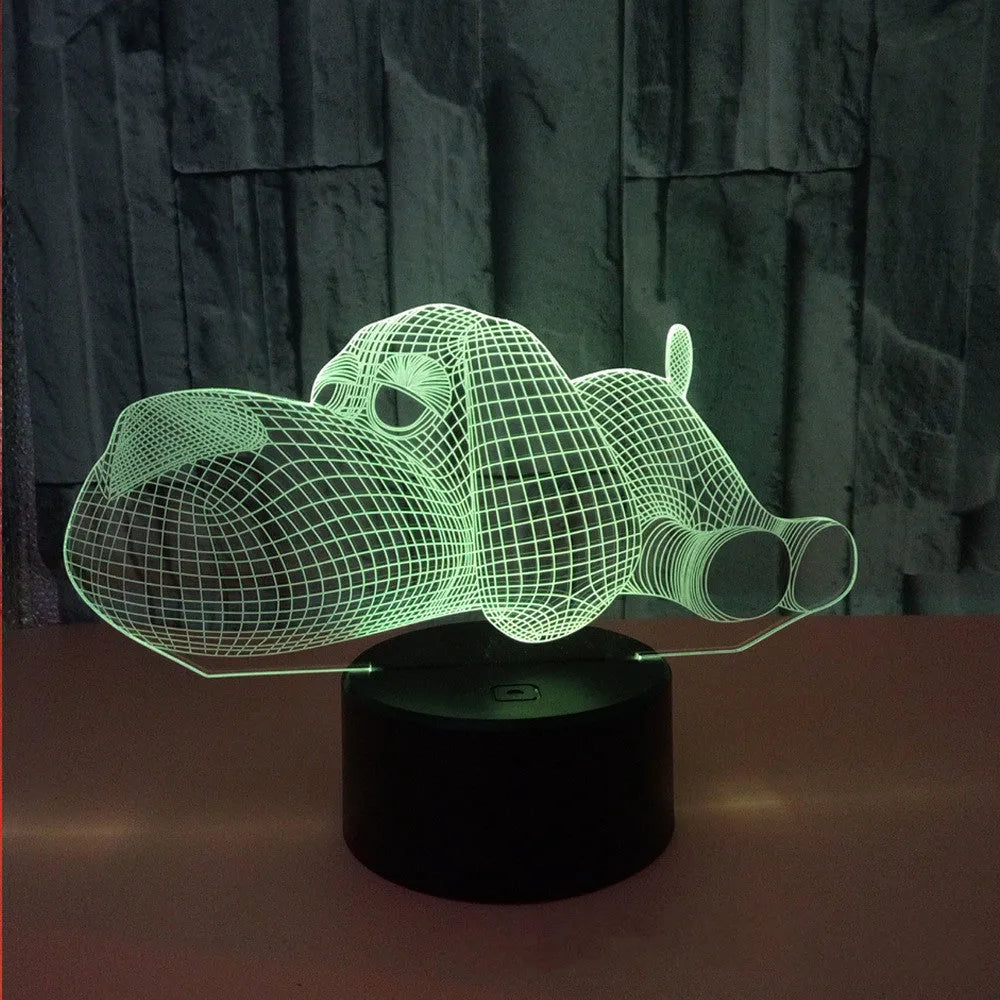 Doggo Desktop Lamp showing 3D dog illusion glowing in blue light on a desk