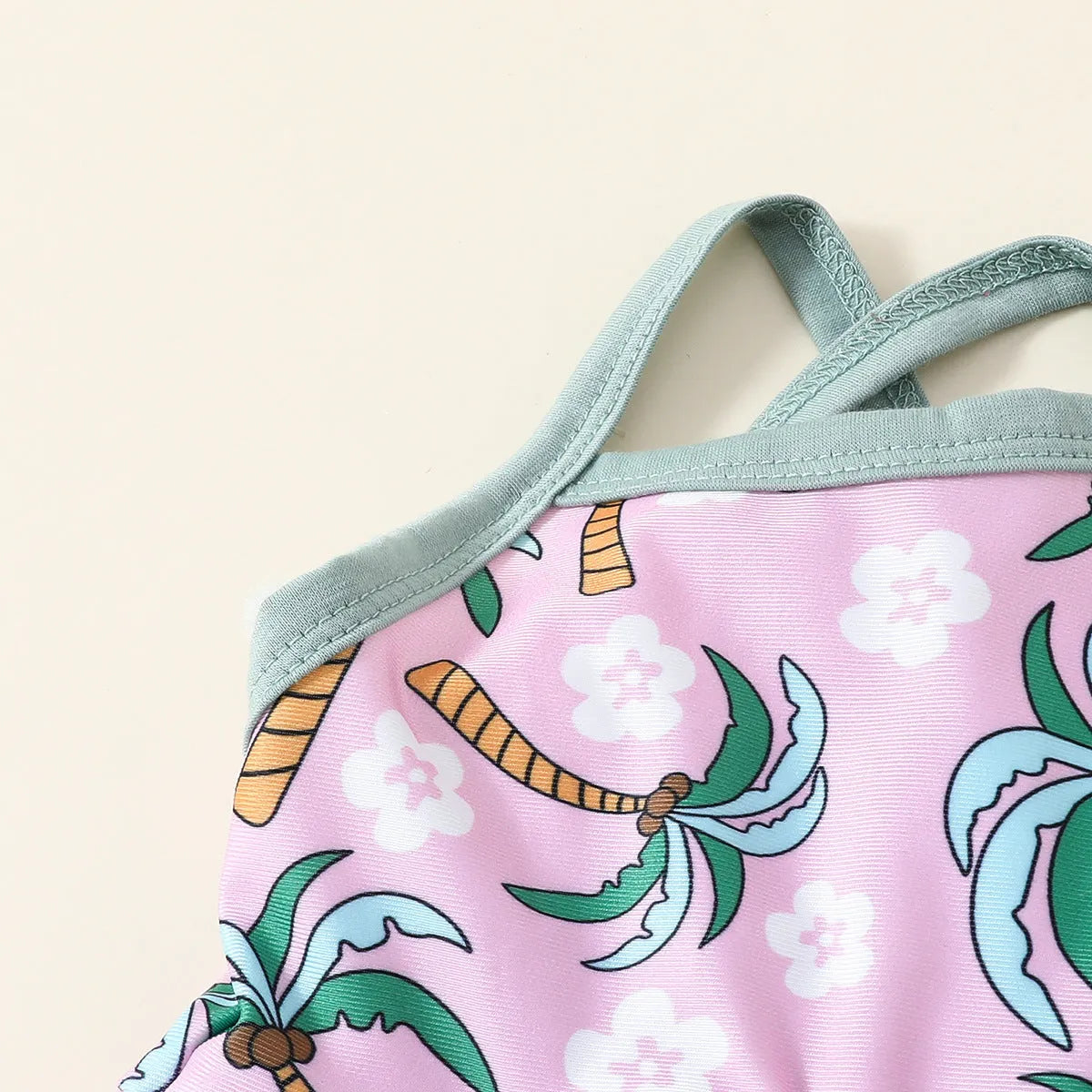 White toddler boy two-piece swimsuit set with shirt and beach shorts on a hanger