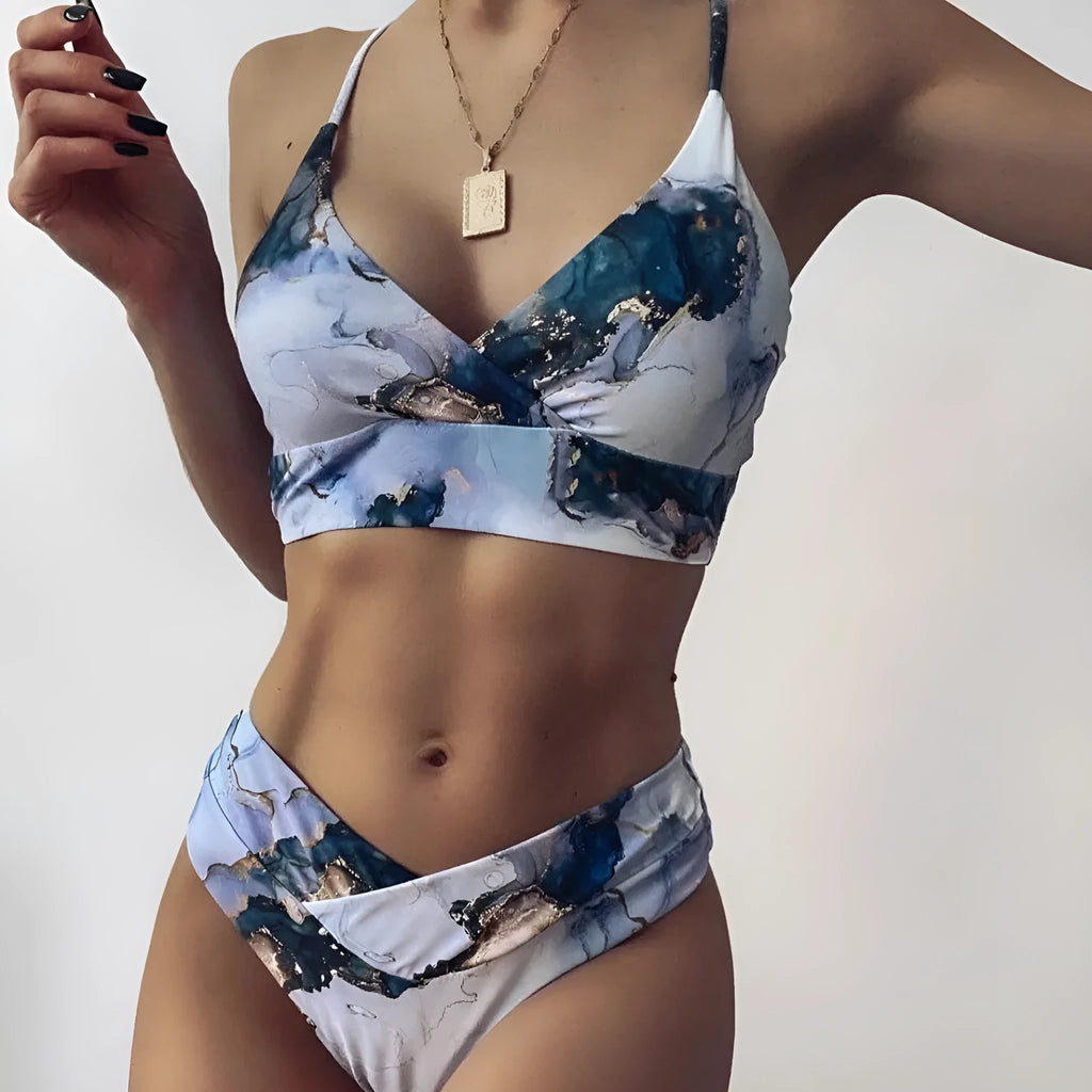 Women's marble tie-dye print high-waisted bikini set with U-neck top on a mannequin.