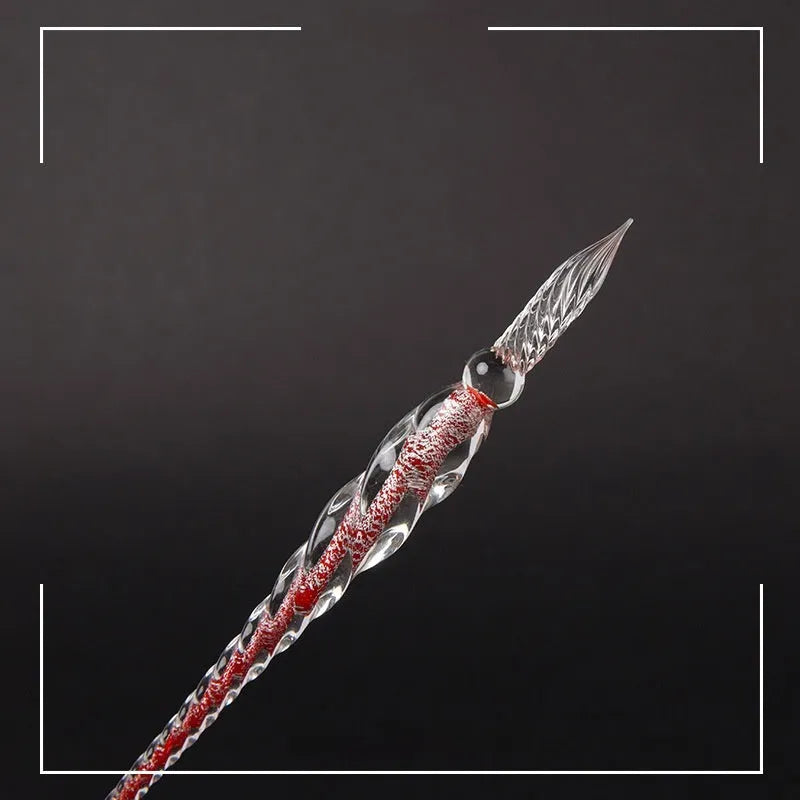 Transparent coloured glaze crystal pen in a gift box, showing abstract glass design.