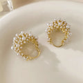 Women's gold flower basket earrings with small beads and pearl inlay details