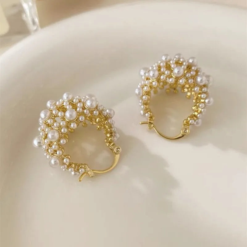 Women's gold flower basket earrings with small beads and pearl inlay details