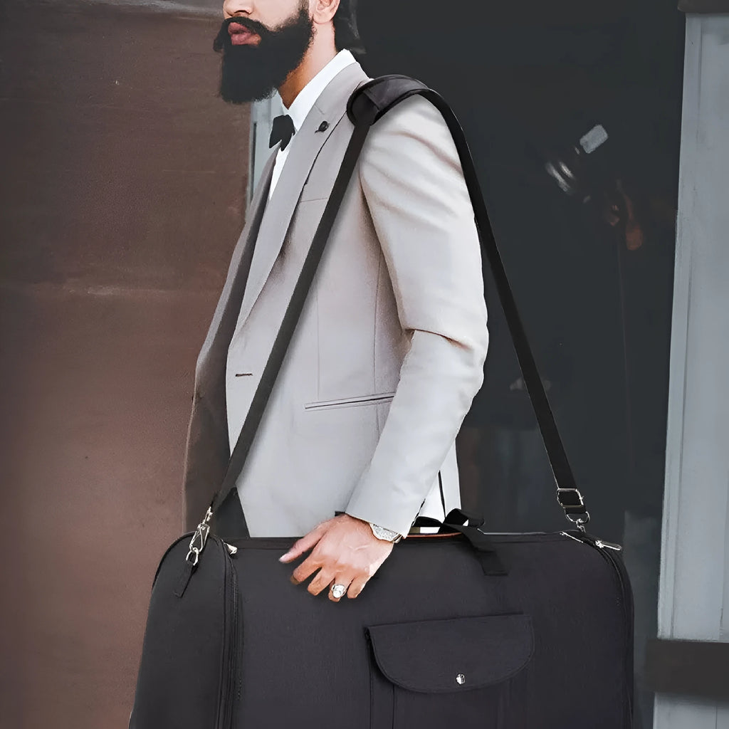 Folding dark blue oxford cloth duffel bag with handles, shown in travel setting.