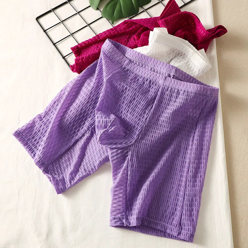 Men's lace fabric boxer shorts in light purple with a lengthened hip lifting shaping design.