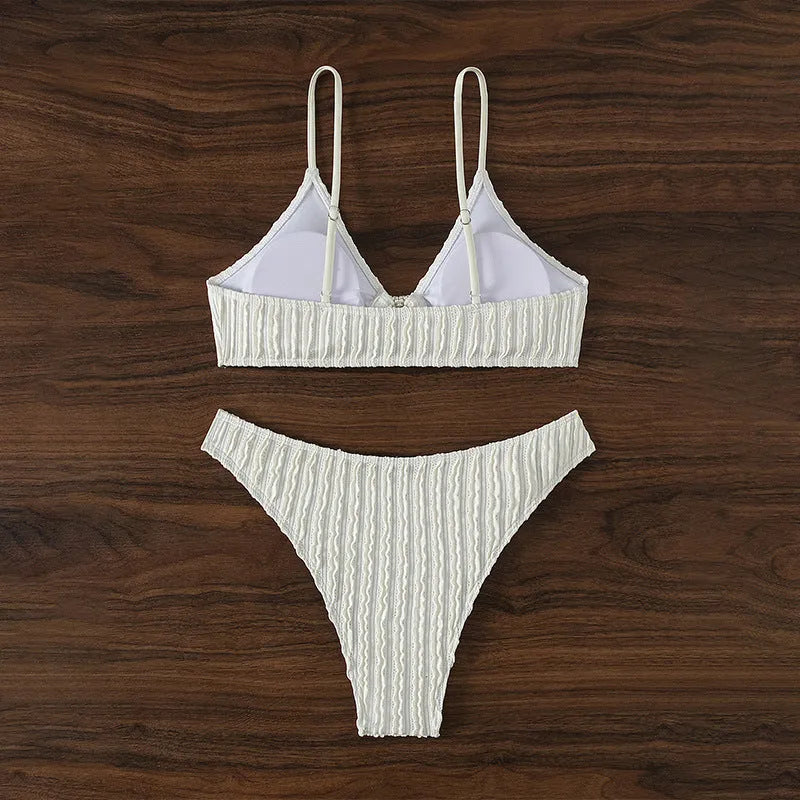 White women's V-neck swimsuit with split skirt design for swimming activities