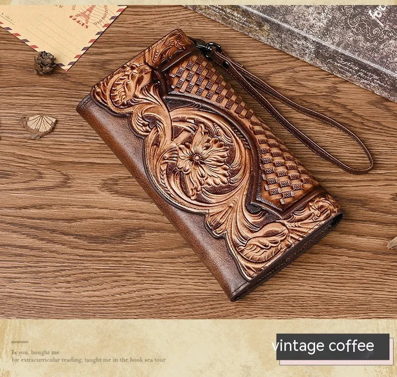 Women's brown embossed floral pattern tri-fold leather wallet showing open compartments