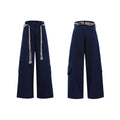 Men's dark blue straight-leg trousers with 3D cutting, zipper decorations, and a tassel pocket detail on a micro-elastic cotton fabric.