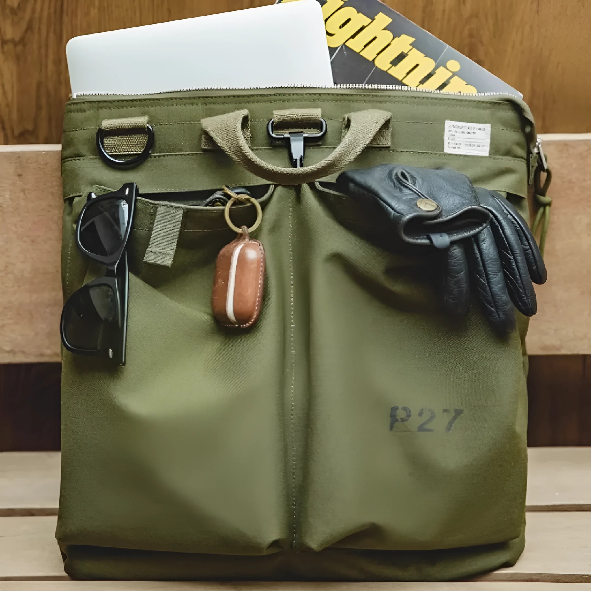 Medium canvas crossbody messenger bag in military green with zipper closure and shoulder strap