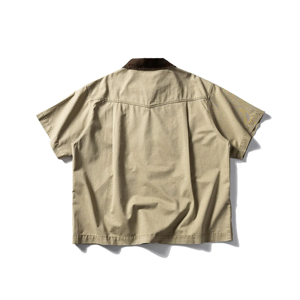 Khaki and grey washed cotton short-sleeved overalls shirt with a loose cardigan fit.