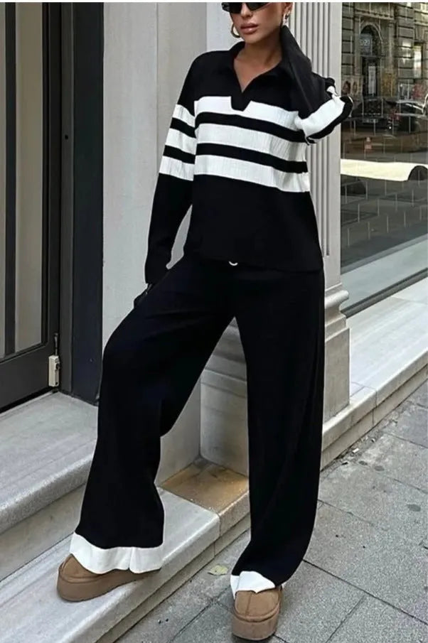 Women's black and white striped knitted two-piece set with polo collar shirt and matching trousers