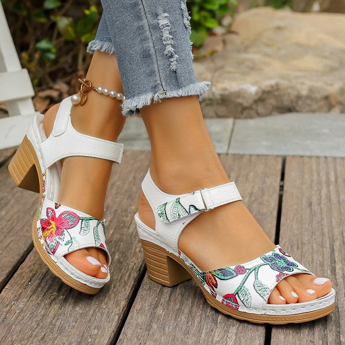 White women's high heel sandals with Velcro buckle fastening showing PU upper and rubber sole