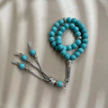 Handmade Muslim daily worship bracelet with 8mm sky blue stone beads on wrist
