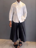 White asymmetric-front long sleeve shirt with black pleated trousers casual set