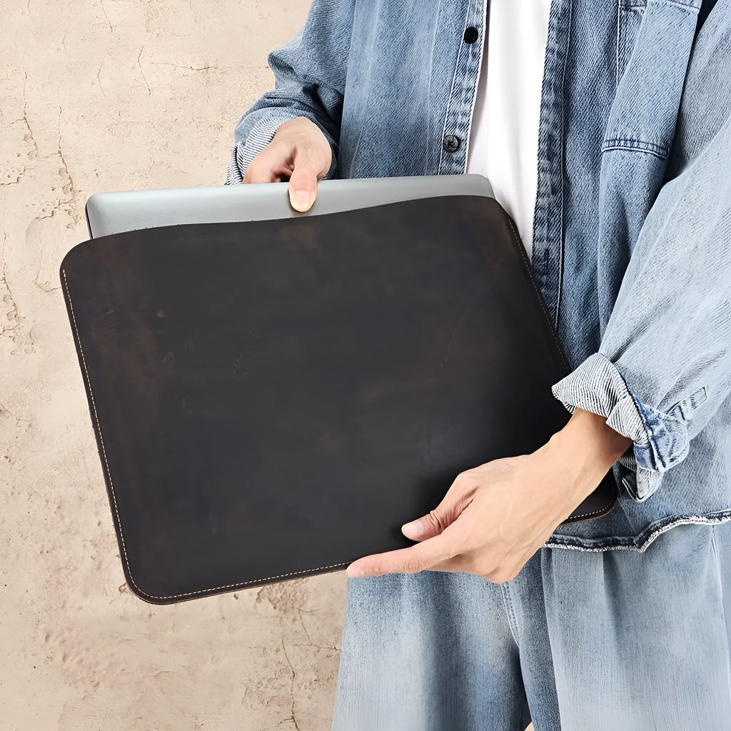 Brown crazy horse leather horizontal computer liner bag showing organisational compartments