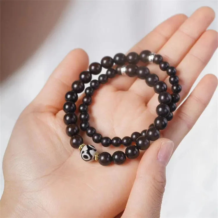 Ebony Tibetan bracelet with two circular beads in 8mm unisex sizing