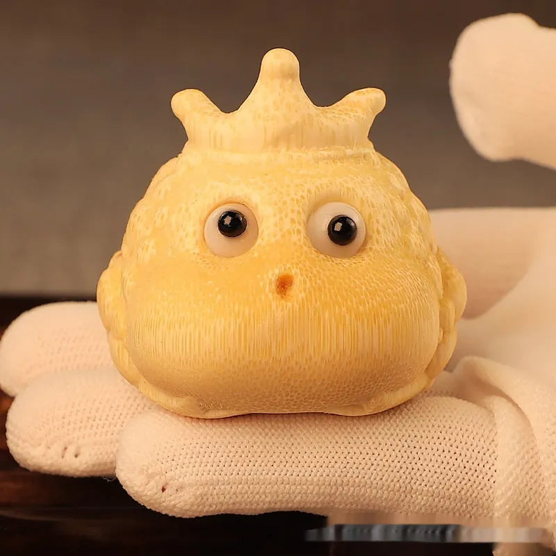 Solid bamboo carving of a Crown Princess Toad ornament with live eye design.