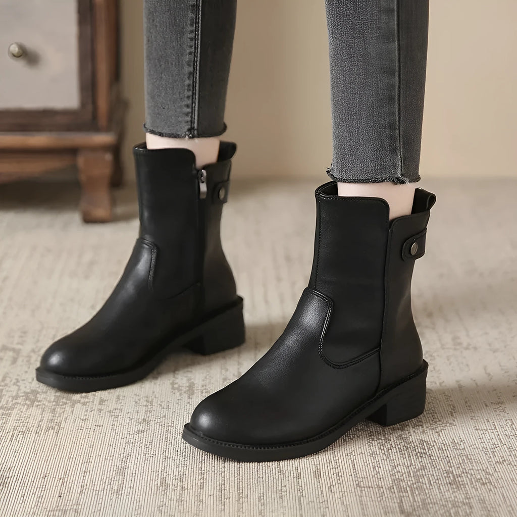 Black women's ankle boots with side zipper and round toe on low rubber heel