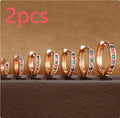 A pair of perforated circle stud earrings in a choice of gold, rose gold, or silver colour.