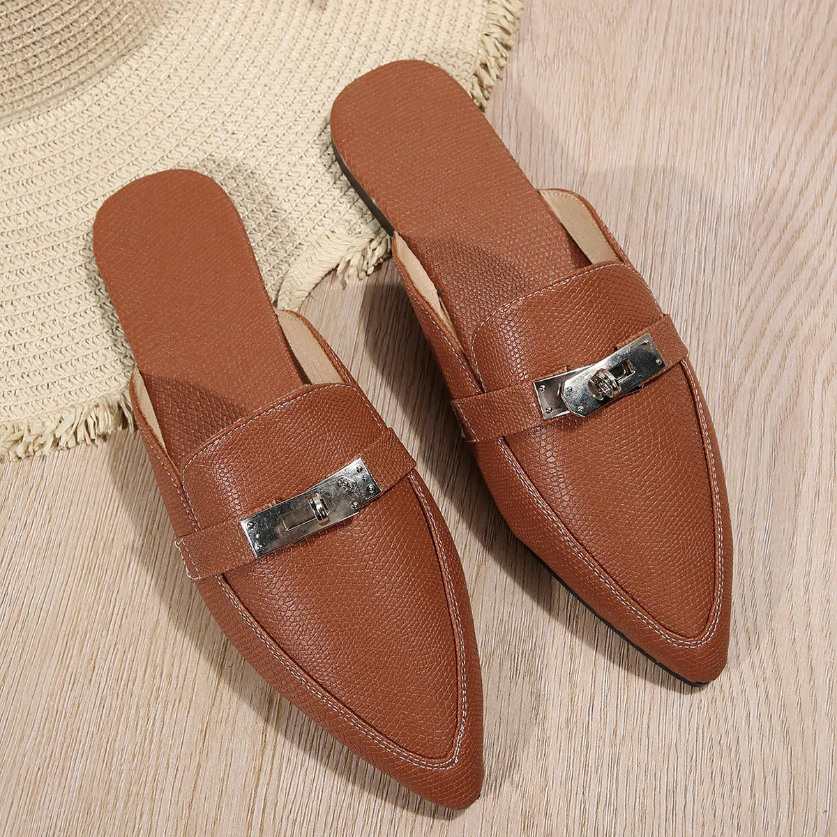 Light brown women's pointed-toe casual slip-on shoes with a low heel and rubber sole.
