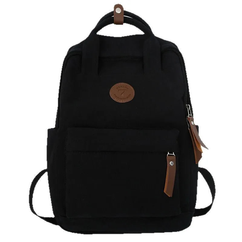 Black Oxford cloth backpack with curved shoulder straps for school and travel