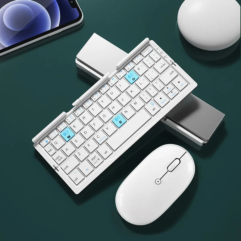 Silver white folding Bluetooth keyboard with built-in stand holding a tablet