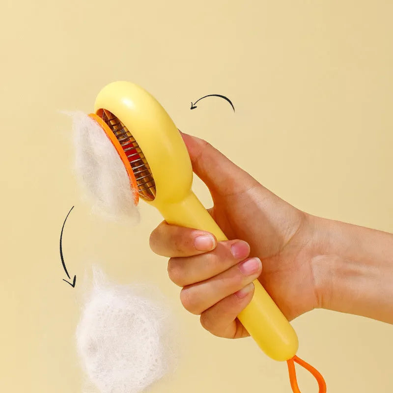 Small yellow duck-shaped pet comb with needle bristles for cat and dog grooming