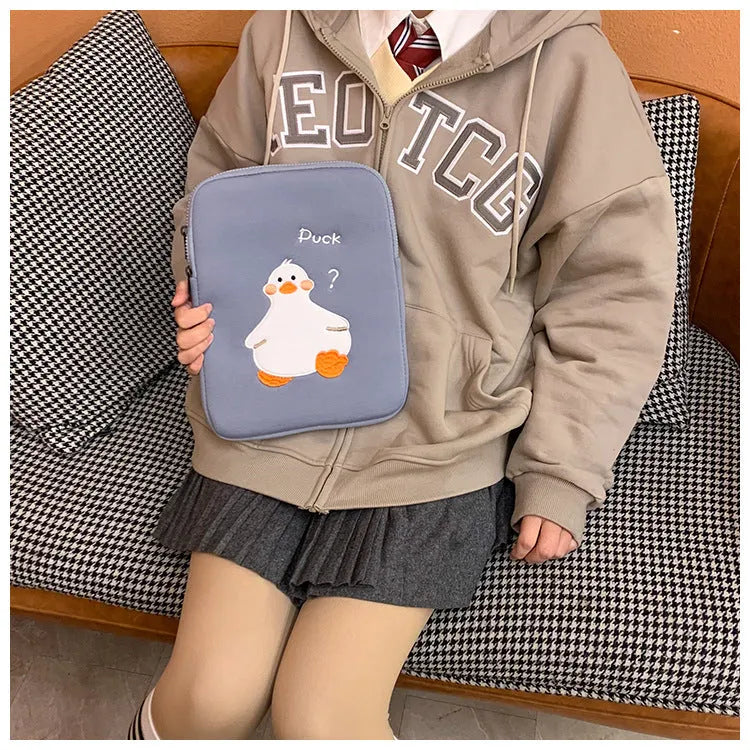 Blue cotton tablet case with duck embroidery design and zipper closure for 11-inch to 16-inch tablets