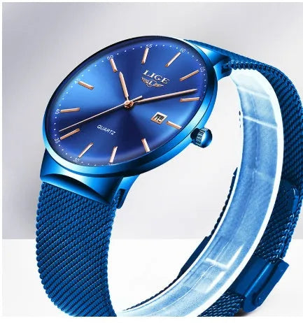 Men's stainless steel watch with 40mm dial on a wrist, showing slim profile.