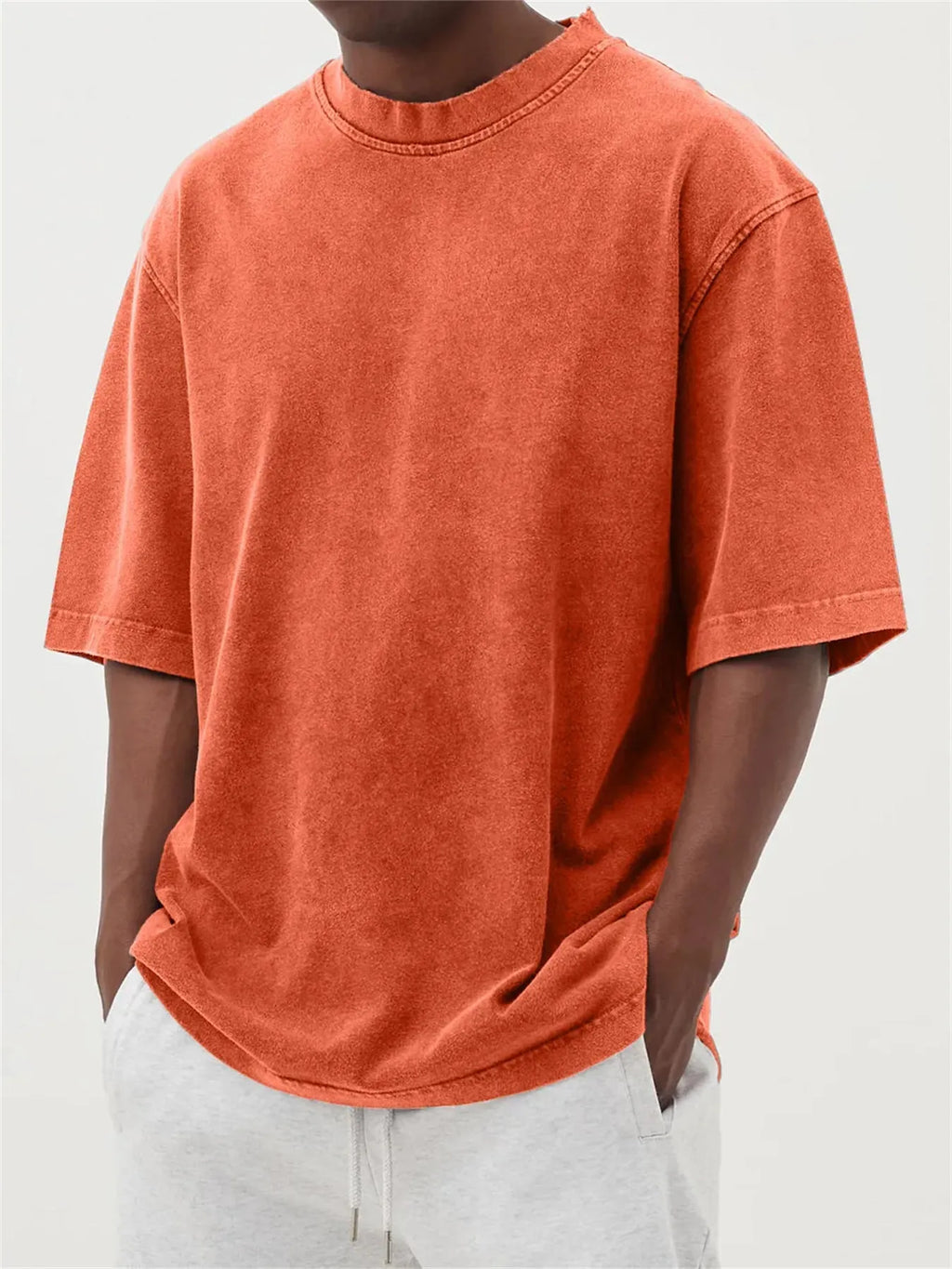 Men's loose fit stone washed polyester t-shirt in army green colour, showing distressed texture and short sleeves.